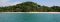 Lush vegetation backs the beach