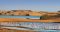 Flamingos by sand dunes, Pelican Point, Walvis Bay, Namibia